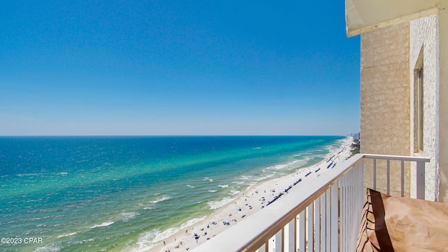 exterior space with a water view and a beach view