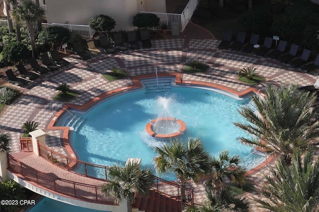 view of pool with pool water feature and a patio