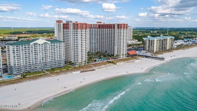 drone / aerial view featuring a view of the beach and a water view