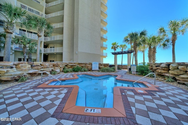 view of pool with a pergola