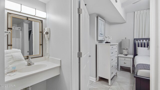 bathroom with tile flooring and vanity