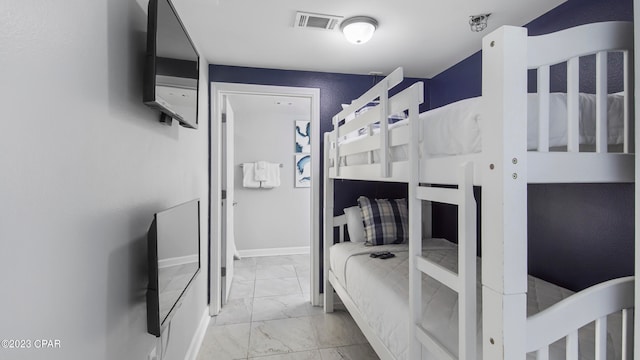 bedroom featuring light tile floors