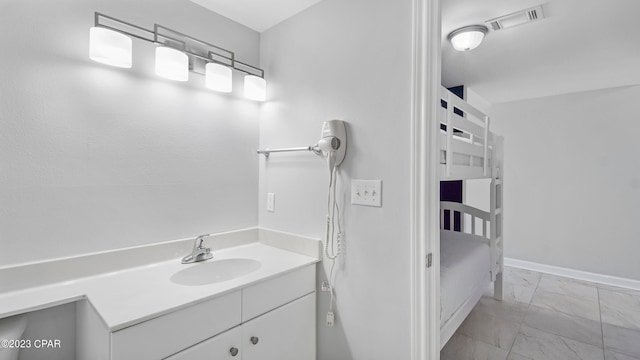 bathroom with vanity and tile floors