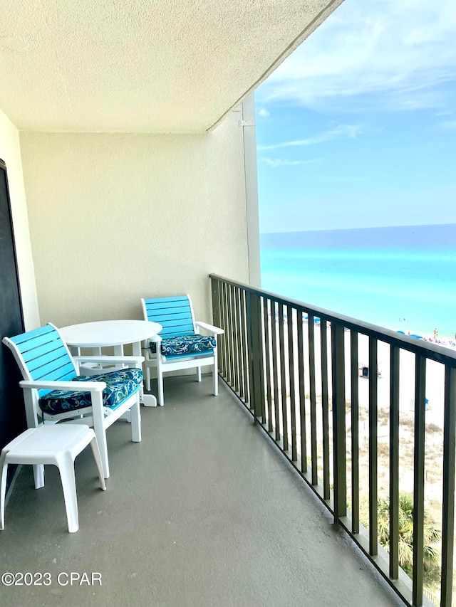 balcony featuring a water view