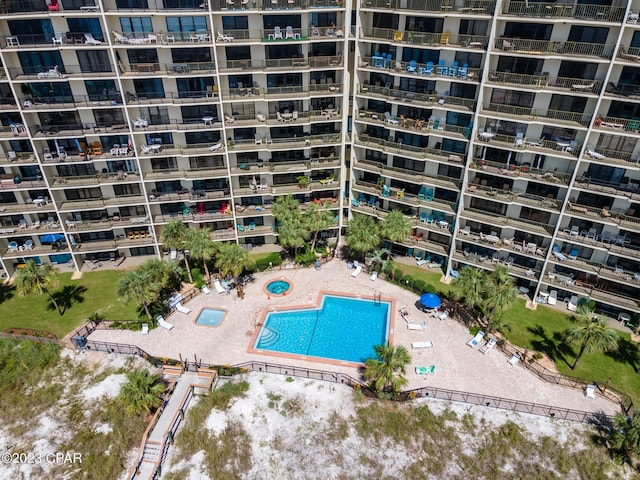 view of building exterior featuring a community pool