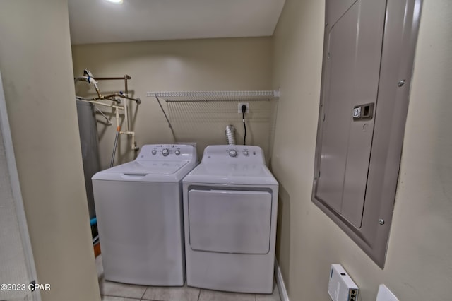 laundry area featuring light tile patterned flooring and separate washer and dryer