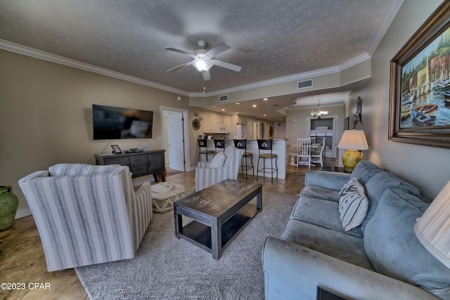 living room featuring ceiling fan with notable chandelier, a textured ceiling, and crown molding