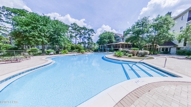 view of pool featuring a patio area