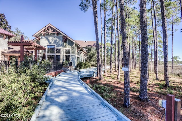 view of home's community featuring a pergola