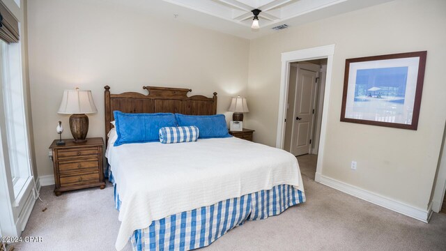 bedroom featuring light colored carpet, ceiling fan, baseboards, and visible vents