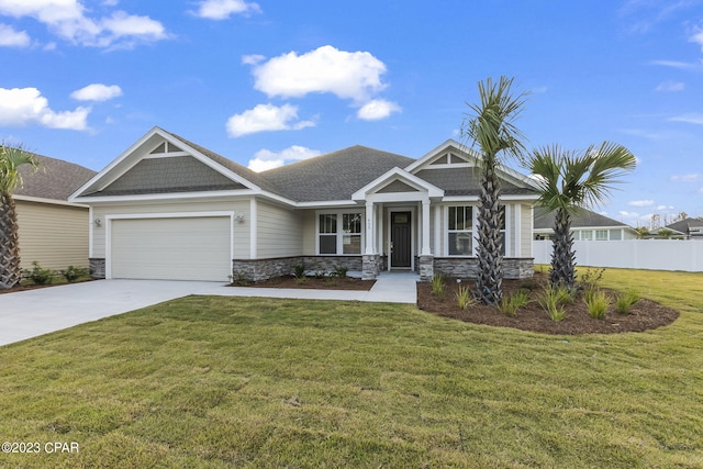 craftsman house with a garage and a front yard