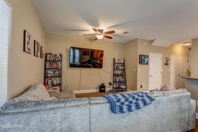 living room featuring plenty of natural light, hardwood / wood-style floors, and ceiling fan