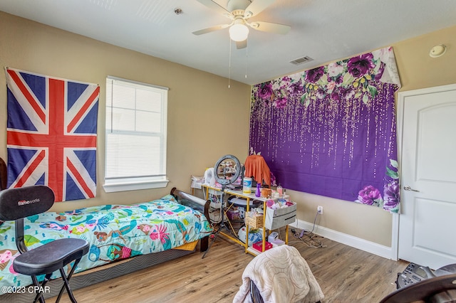 bedroom featuring ceiling fan and light wood-type flooring