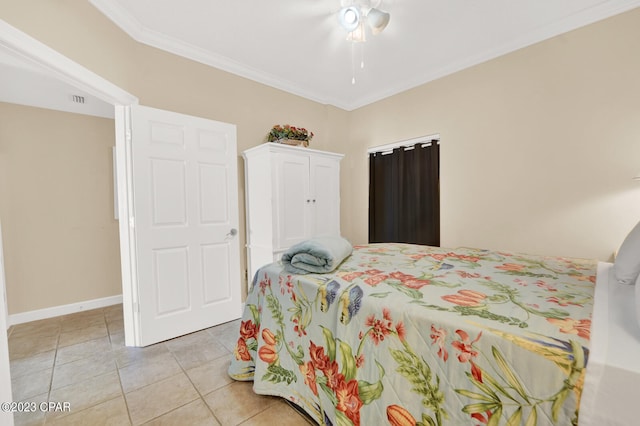 bedroom featuring light tile patterned floors, ceiling fan, and ornamental molding