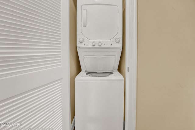 washroom with stacked washer and clothes dryer