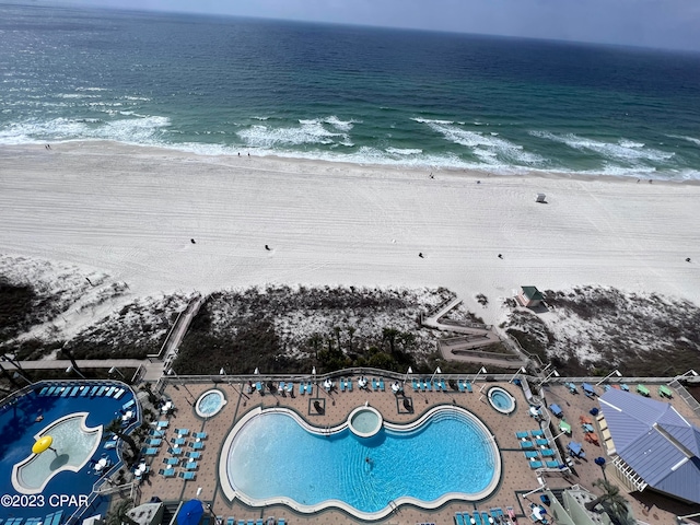 aerial view featuring a water view and a view of the beach