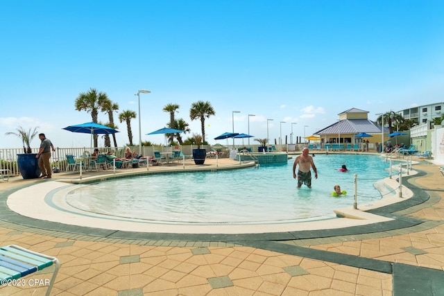 view of swimming pool featuring a patio