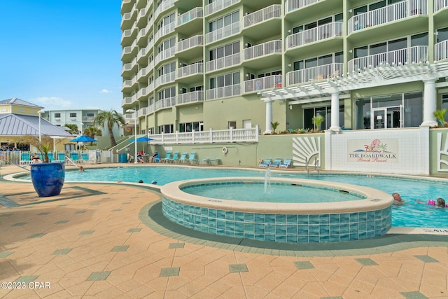 view of pool with pool water feature