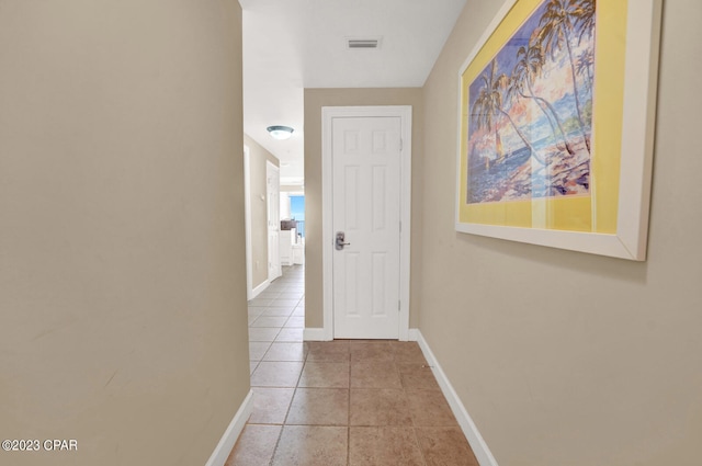 hallway with light tile patterned floors