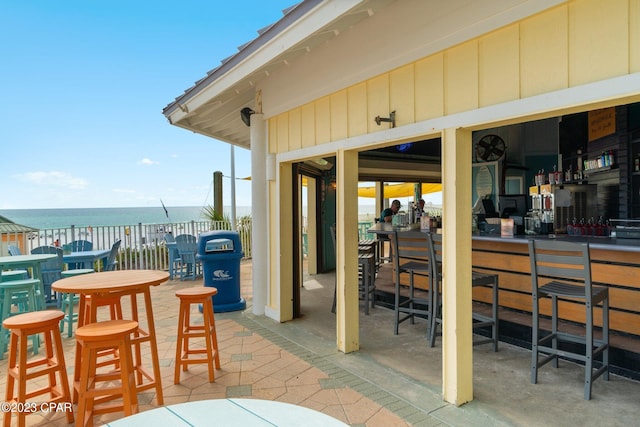 view of patio with a water view