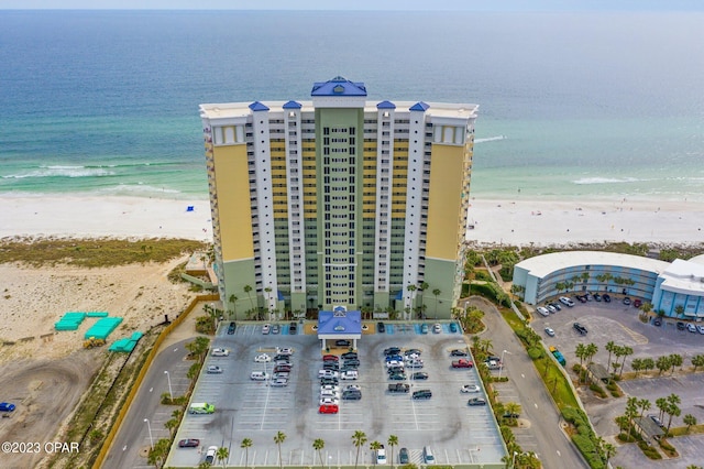 bird's eye view with a view of the beach and a water view