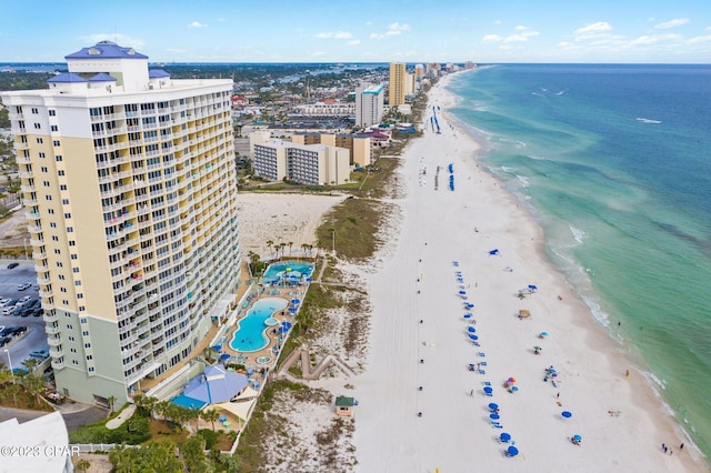 birds eye view of property featuring a view of the beach and a water view