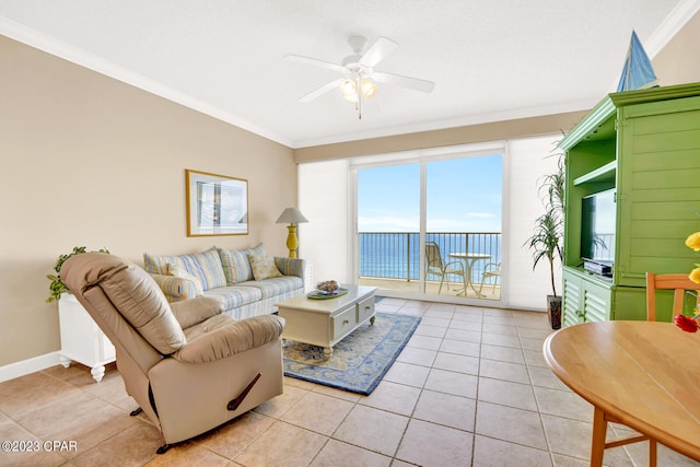 living room with ceiling fan, light tile patterned flooring, and crown molding