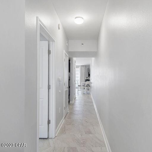 hall featuring light tile floors