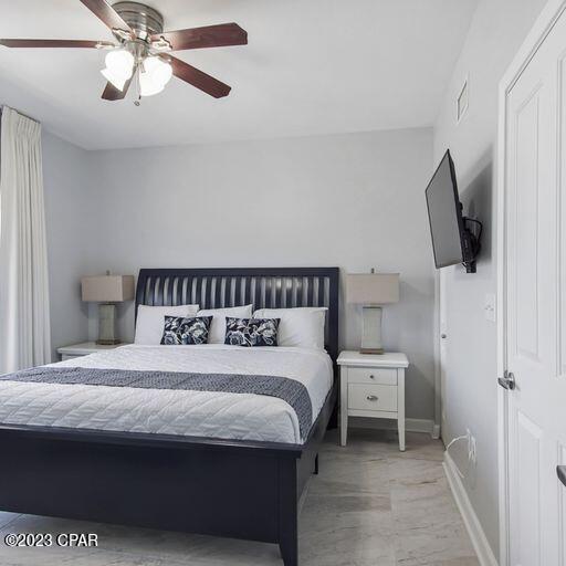 bedroom featuring light hardwood / wood-style floors and ceiling fan