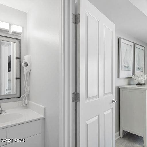 bathroom with vanity and tile floors