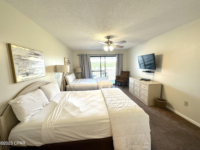 bedroom featuring access to exterior, ceiling fan, dark colored carpet, and a textured ceiling