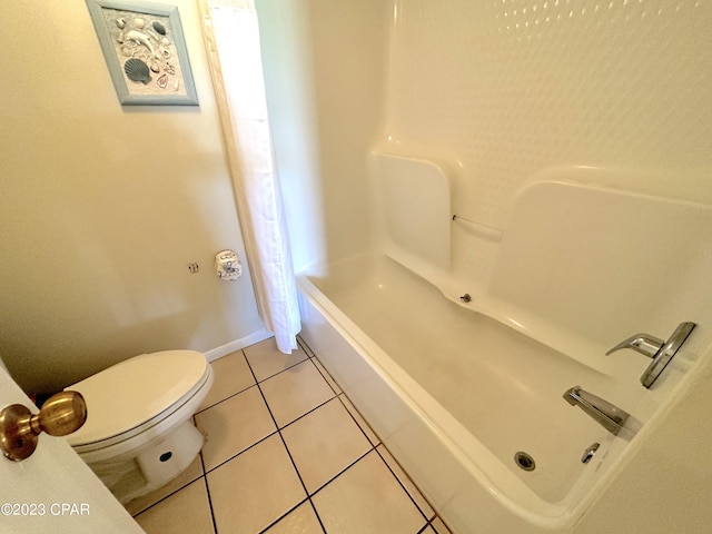 bathroom with tile flooring, shower / tub combination, and toilet