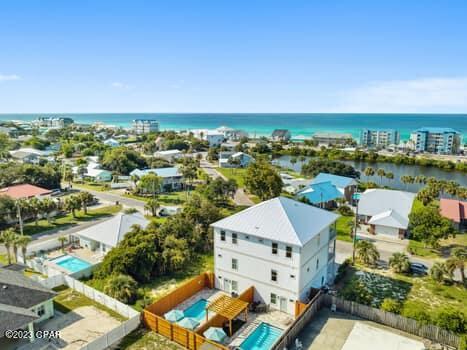 birds eye view of property with a water view