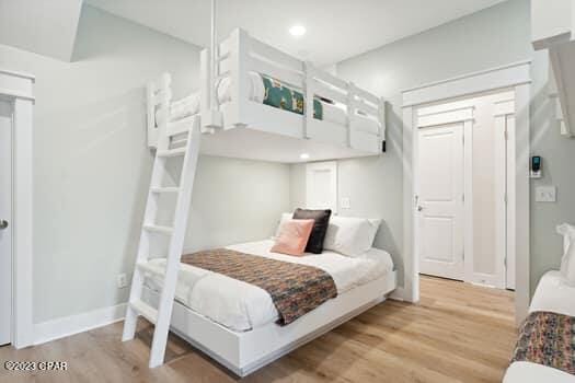 bedroom with light wood-type flooring