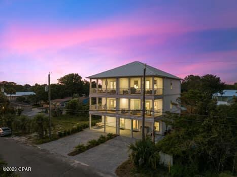 view of front of property with a garage and a balcony