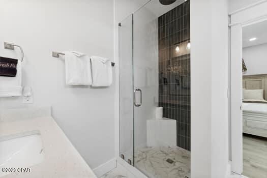 bathroom featuring vanity and walk in shower