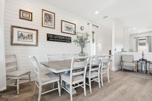 dining space featuring wood-type flooring