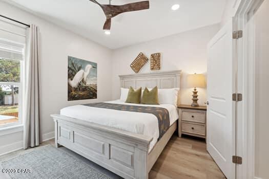 bedroom featuring ceiling fan and light wood-type flooring