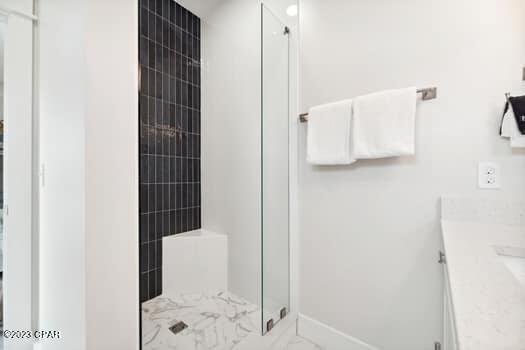 bathroom with vanity and an enclosed shower