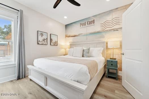 bedroom featuring ceiling fan and light hardwood / wood-style floors