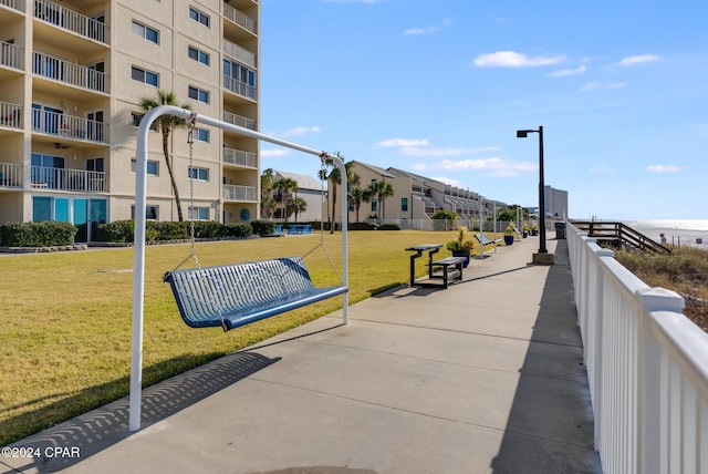 view of community featuring a yard