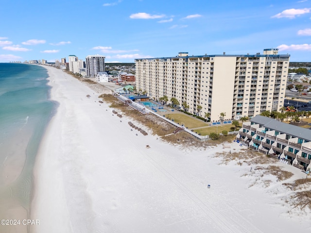 bird's eye view featuring a beach view and a water view