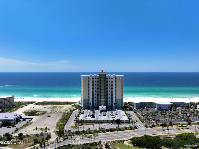 drone / aerial view with a water view and a view of the beach