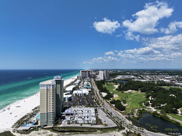 birds eye view of property with a beach view and a water view