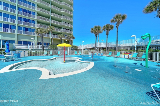 view of pool with pool water feature