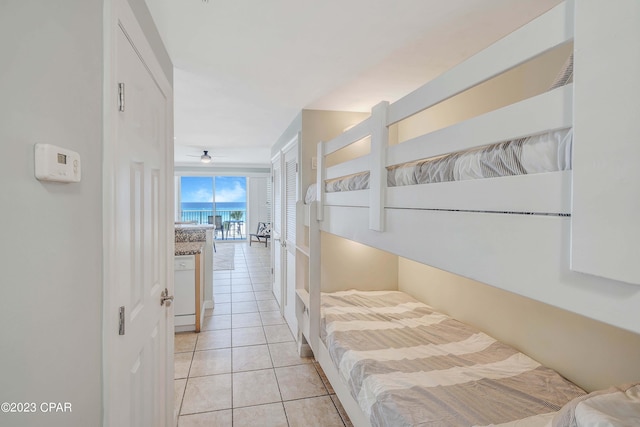 bedroom with a closet and light tile patterned floors