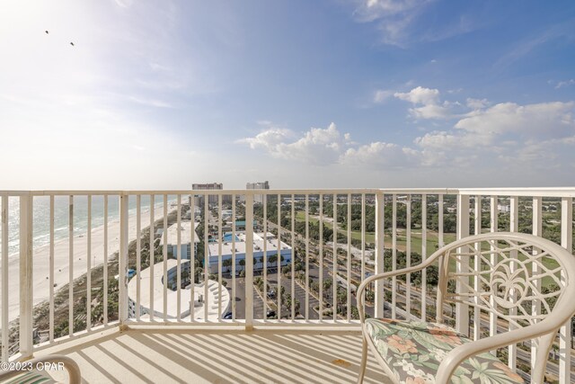 balcony with a view of the beach and a water view