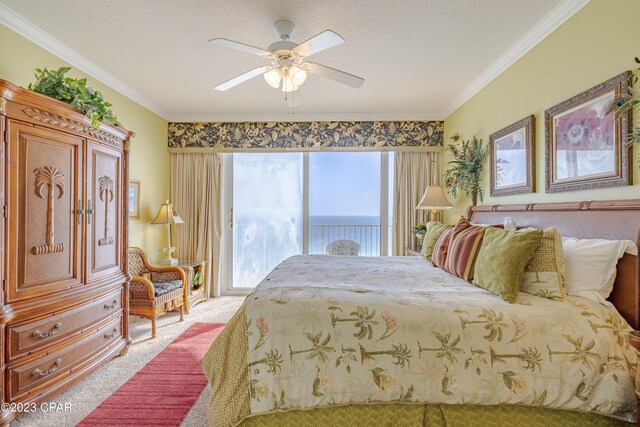 carpeted bedroom with ornamental molding, ceiling fan, and a textured ceiling