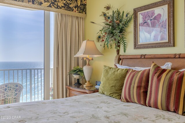 bedroom featuring a water view