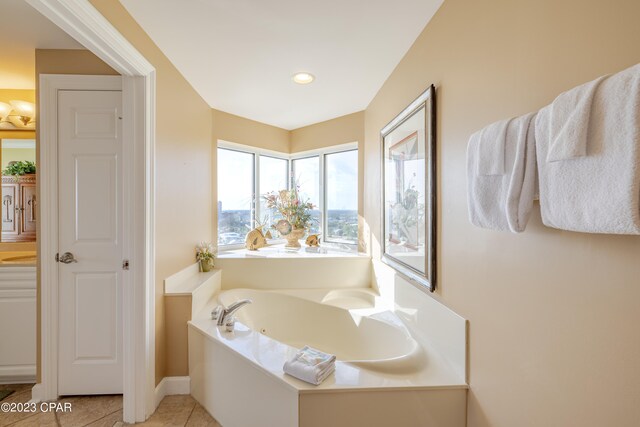 bathroom with tile patterned flooring and a washtub